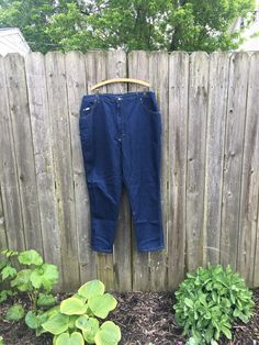 These denim jeans are incredible and want to live the life they never had. If you want to look perfect in some dark wash jeans, these are the perfect pair for you. They are in perfect condition with no rips, holes, stains or smells. Measurements: laying flat and doulbed Waist: 38 1/2 inches Hips: 52 1/2 inches Rise: 16 1/4 inches Inseam: 30 inches Length: 42 inches Size on tag: 26W (compare to a size 20 in today's sizes, check measurements) 90s Style Dark Wash Denim Jeans, Vintage Dark Wash Denim Jeans, 90s Style Dark Wash Rigid Denim Jeans, Painters Pants, Lee Denim, Vintage Vans, Womens Jeans, Button Dress, Asian Style