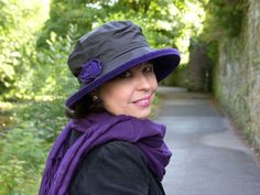 "In our range of rain hats, we have the ever-popular Elizabeth wax hat. It is elegant, stylish and ageless using velvet or tweed with British manufactured wax cotton so this women's rain hat will keep you dry whatever the weather. This is a particularly popular purple one. Please choose your size of hat carefully and measure your head as shown in the photograph. Do not pull the tape too tight, ensure you have it around the widest part of your head where the hat will sit (see photograph), and make sure the tape is not too baggy either. If you don't have a sewing tape measure use a piece of non-stretchy string around your head then lay it along a measure. Measure across your forehead, the tops of your ears and around the nape of your neck where the hat will actually sit. You have a choice of Special Occasion Hats, Waterproof Hat, Match Velvet, Baker Boy Hat, Velvet Rose, Rain Hat, Purple Hats, Velvet Hat, Belle Rose