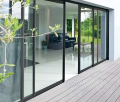 an open patio with sliding glass doors leading to the outside