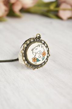 Your zodiac witchy necklace collection is not complete without a Leo necklace lion sign. Handmade with whimsical, cute miniature art and a vintage style, this Leo pendant ignites your inner magic. The Leo jewelry is painted by hand, making each piece unique and one of a kind, just like you. Click through to see more glass pendant necklaces! Leo Pendant, Leo Jewelry, Leo Necklace Zodiac, Leo Necklace