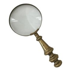 a magnifying glass sitting on top of a metal pole