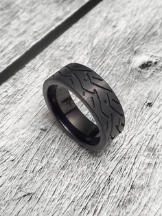 This is a car/motorcycle enthusiast dream ring! This solid and hearty ring has some weight to it giving it the look and feel that a mans ring should encompass Black Tire 8.4mm Band Metal: Black Tungsten Finish: Black Item # RLRTS-522 »» $ BU Y * M O R E * S A V E * M O R E $ «« ✦ Special 15% OFF when you order 2 items!! ✦Special 20% OFF when you order 3 or more items!! -- -- K E E P * I N * T O U CH https://instagram.com/ringlizardjewelry https://www.facebook.com/ringlizardjewelry Thank you for Black Biker Style Ring As Gift, Black Biker Rings For Biker Events, Tire Ring, Tire Rings, Mans Ring, Woman Mechanic, Band Metal, Black Tungsten, Wolfram