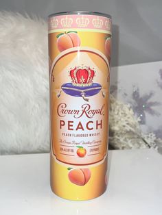 a can of peach tea sitting on top of a table