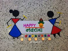 a happy diwali sign with candles on it