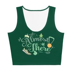 Almost there! Perfect for any Tiana and runDisney fan, this shirt is perfect for Princess and the Frog fans whether you're running runDisney Princess Half marathon weekend, or around your neighborhood. With a running shoe and medal, flowers, frog princess and much more. Shirt Reads: Almost there Disney event: runDisney Enchanted 10k during Princess half mafrathon weekend Disney character: Tiana Look fabulous in an all-over printed, body-hugging crop top. • 82% polyester, 18% spandex • Fabric wei Tiana Running Costume, Disney Green Tops With Character Print, Green Disney Character Print Top, Casual Green Tops For Running, Tiana Almost There, Disney Running Costumes, Rundisney Princess, Tiana Costume, Disney Outfits Women