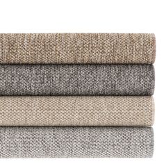 four different colored carpet samples stacked on top of each other in various sizes and colors