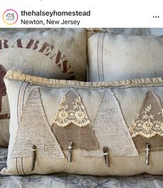 three decorative pillows on top of each other