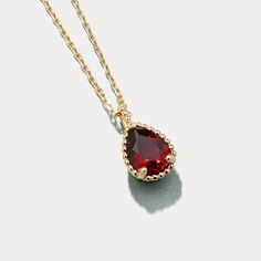 This Garnet Morning Dew Necklace is a luxurious piece crafted to perfection from gleaming gold set on a sleek silver base. Perfect for any occasion, this necklace is the ideal statement piece to elevate your look and add a touch of timeless elegance. An exquisite accessory for any wardrobe, the Garnet Morning Dew Necklace will easily become your go-to for day-to-day wear or special occasions. DETAILS Plating:  9 K Gold  Materials:  9 K Gold on Silver, Natural Mozambique Garnet Measurements :   L Dainty Pendant Birthstone Necklace For Formal Occasions, Formal Gold-plated Birthstone Necklace, Formal Pendant Birthstone Necklace, Formal Gold Plated Teardrop Necklaces, Elegant Gold Birthstone Necklace With 17 Jewels, Elegant Teardrop Gemstone Charm Necklaces, Classic Teardrop Pendant Jewelry, Tarnish Resistant, Elegant Drop Necklace With Tarnish Resistance, Elegant Teardrop Gemstone Charm Necklace