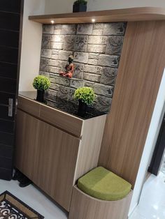 a bathroom with a stone wall and wooden cabinets