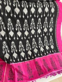 It's a pure cotton hand block printed ikkat dupatta Luxury Bohemian Batik Print Dupatta, Pink Cotton Handloom Dupatta, Black Bohemian Handloom Dupatta, Traditional Pink Block Print Dupatta, Bohemian Black Dupatta With Woven Motifs, Black Block Print Dupatta With Traditional Drape, Traditional Pink Dupatta With Block Print, Pink Dupatta With Block Print In Traditional Drape, Cotton Ikat Print Saree For Festivals