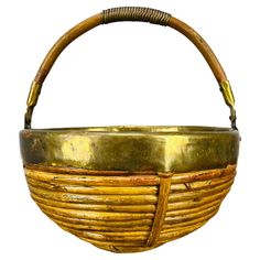 an old basket is sitting on a white surface with a handle in the shape of a basket