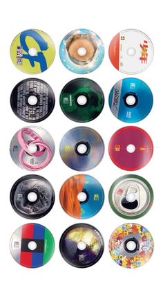 many different colored discs are arranged in a row on a white background, with one being the same color as the other