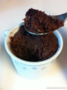 two scoops of chocolate ice cream in a bowl