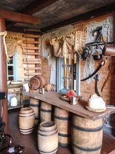 an old fashioned bar with lots of barrels