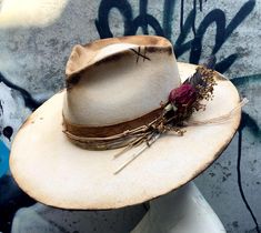 This was a new Olive & Pique adjustable ranch hat. It has a flat, structured 3.5" brim and a 4.5" pinched crown. The band is buckskin overlaid with dyed, burned silk, leather cord and twine. A long dark feather, a dried rose and an African porcupine quill finish off the side. Burned bits and random etching add to the aged feel. Size is up to 59cm or large but fits most due to the inner Velcro band. Free shipping via USPS Priority Mail, and always shipped quickly! African Porcupine, Porcupine Quills, Festival Hat, Country Girl Style, Western Wedding, Desert Rose, Country Girl, Country Girls, Leather Cord