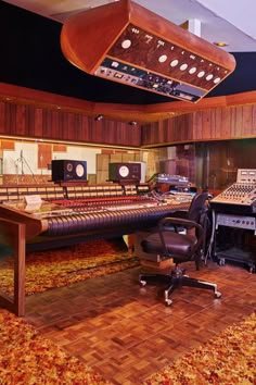 an empty recording studio with lots of equipment