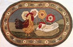 an oval rug with roosters and flowers on the ground in front of a white background