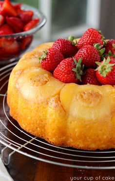 a pineapple upside down cake with strawberries on top