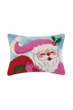 a santa clause pillow on a white background