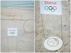 there are two signs on the beach and one has a frisbee in it