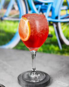 a close up of a drink in a glass on a table