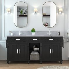 a bathroom with two sinks and mirrors on the wall next to a rug in front of it