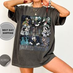 a woman is posing in front of a wall with her hand on her head and wearing mickey mouse t - shirt