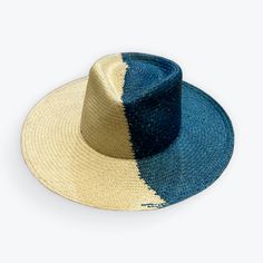 TWO-TONE STRAW HAT The Two-Tone Straw Hat has been handwoven in Ecuador using only toquilla straw. It is not only strikingly gorgeous, but it is universally flattering with its wide teardrop and slightly creased crown, and flat wide brim. This hat screams style and is extremely versatile as it can be styled up or down for every occasion. Style - Large Brim Material - 100% Toquilla Straw Dimensions: Crown - 3.5" (8.9 cm) in front and back, 4." (10 cm) on the sides Brim - 4" (10 cm) Other details: Handwoven Toquilla Straw Hat With Curved Brim, Handwoven Straw Panama Hat With Curved Brim, Handwoven Toquilla Straw Boater Hat With Curved Brim, Handwoven Curved Brim Panama Hat, Handmade Toquilla Straw Panama Hat With Curved Brim, Handmade Straw Panama Hat With Curved Brim, Handmade Straw Hat With Curved Brim, Handmade Curved Brim Straw Hat, Handmade Toquilla Straw Hat With Curved Brim