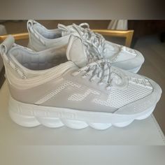 Brand New White Versace Chain Reaction Sneakers. Never Worn. No Box. Thick Sole Provides Great Comfort And Stylish Look. There Is A Black Marker Dot On The Tag, Which Is Visible In Photo And Was On Shoes When I Purchased Them. Versace Chain Reaction Sneakers, Versace Chain, Versace Shoes, Chain Reaction, White Sneakers, Mens Shoes Sneakers, On Shoes, Versace, Men's Shoes