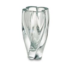 a clear glass vase sitting on top of a white table