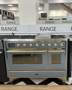 an old fashioned stove and oven are on display in a store or showroom for sale