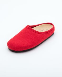 Description: The Nebraska Women's Wool Clog is an Italian take on a European classic. The women's Nebraska in red is one of the most versatile mule style slippers available. From home to the office to weekend, the minimalist design of these clogs will take you anywhere in comfort. The anatomical self-molding latex and thermoforming cork insole provide a firm customized comfort, and the insole is completely removable. LeClare Slippers are exclusively handcrafted in our small-batch factory in Trev Comfortable Red Slippers With Rubber Sole, Slip-on Indoor Clogs, Solid Color Slip-on Clogs With Rubber Sole, Red Leather Sole Slip-on Slippers, Red Slip-on Slippers With Leather Sole, Red Slip-on Slippers With Rubber Sole, Red Comfortable Slip-on Slippers, Comfortable Red Slip-on Slippers, Red Flat Slippers With Cushioned Footbed