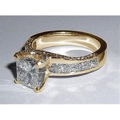 an engagement ring with a princess cut diamond