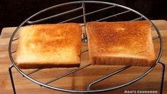 two pieces of toast sitting on top of a metal rack