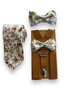 "Floral Brown Bow Tie and Tan 1 inch wide leather suspenders and bow tie set for groomsman or ring bearer. Size 1-2years old suspenders are up to 25\" long. Size 3-6 years old suspenders are up to 30\" long Size 7-12 years old  suspenders are up to 33\"long.  Size Adult suspenders are 45\" long. The regular necktie is 3 1/2\" wide, and skinny adult necktie is 2 1/2\" wide, 60\" long. Please remember that the suspenders are made of elastic and will stretch. They can stretch up to 10 extra inches. Groomsmen Bow Tie And Suspenders, Floral Bow Tie Wedding Groomsmen, Brown Suspenders Wedding, Dapper Adjustable Belts And Suspenders With Ties, Adjustable Bow Tie For Groom, Summer, Adjustable Summer Bow Tie For Groom, Adjustable Summer Bow Tie For Grooms, Summer Wedding Bow Tie For Groom, Adjustable Belts And Suspenders For Father's Day Gift