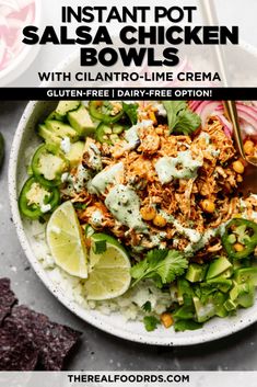 the instant pot salsa chicken bowls with cilantro - lime crema is ready to be eaten