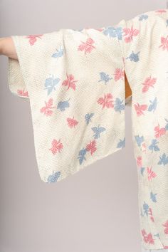 Magical pastel blue & pink floral shibori (tie dye) Japanese haori kimono jacket with beige lining. Wear over a slip dress, with jeans and a tee, or as a gorgeous robe. One size fits most! Length 33”Shoulder to shoulder 26.5”Sleeve 13”Sleeve hang 18.5” Excellent vintage condition, with normal wear and condition for its age.For international shipping rates, please send inquiries to our CONTACT page. Dress With Jeans, Japanese Haori, Haori Jacket, Kimono Coat, Shibori Tie Dye, Kimono Jacket, Pastel Blue, Shibori, Vintage Tops