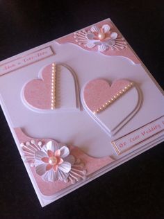 a card with hearts and flowers on it