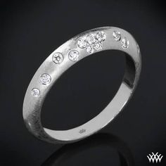 a white gold ring with diamonds on it