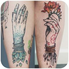 two tattoos on both legs with hands and flowers in the middle one is holding a flower