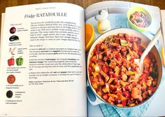 an open cookbook with pictures of vegetables and other food items on the table top