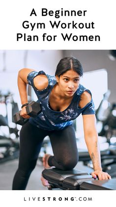 a woman working out in the gym with dumbs on her chest and arms behind her back