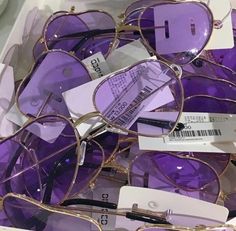 purple heart shaped glasses with tags on them