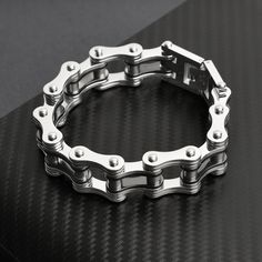 Description: Looking for a unique and stylish bracelet that shows off your love of biking? The Stainless Steel And Black Bike Chain Bracelet is the perfect accessory for you! Made of high-quality materials, this bracelet is built to last. The black bike chain design is eye-catching and gives the bracelet a cool, edgy look. Whether you're hitting the trails or cruising around town, this bracelet is sure to turn heads. So show off your passion for biking in style with our Stainless Steel And Black Biker Style Stainless Steel Jewelry For Biker Events, Biker Style Chain Jewelry For Biker Events, Silver Biker Bracelets For Gift, Silver Biker Style Bracelets As Gifts, Bike Chain Bracelet, Biker Chain, Biker Jewelry, Black Bike, Bike Chain