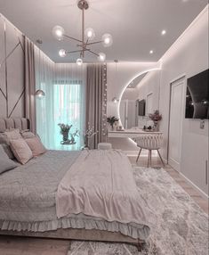 a bedroom with a large bed sitting next to a window and a mirror on the wall