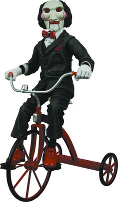 a creepy clown riding a tricycle with red wheels and no face on it's head