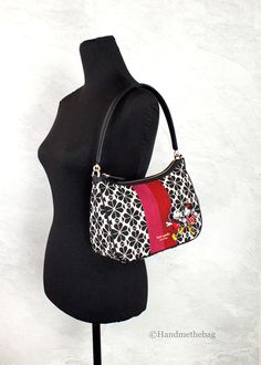 Style: Kate Spade X Disney 100 Sam Small Spade Flower Shoulder Bag Material: Jacquard Canvas Features: Adjustable/Detachable Crossbody Strap, Inner Zip and Slip Pockets, Zip Closure, Lined Measures: 10" L x 7.75" H x 3.75" D Disney 100, Crossbody Strap, Kate Spade, The 100, Shoulder Bag, Disney, Canvas