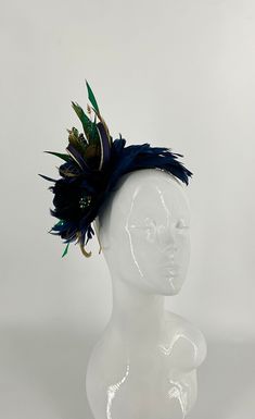 A beautiful elegant navy and gold bespoke handmade feather fascinator, with peacock feathers. Handmade cut feathers with a handmade feather flower designed with navy and gold loops on a gold metal headband. 27cm height x 24cm wide x 9cm wide Metal Headband, Feather Fascinator, Fascinator Headband, Feather Fascinators, Feather Flower, Gold Feathers, Metal Headbands, Crown Headband, Gold Halo