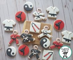 decorated cookies are arranged in the shape of karate players