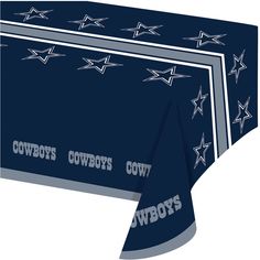 the cowboys tablecloth is blue and has silver stars on it